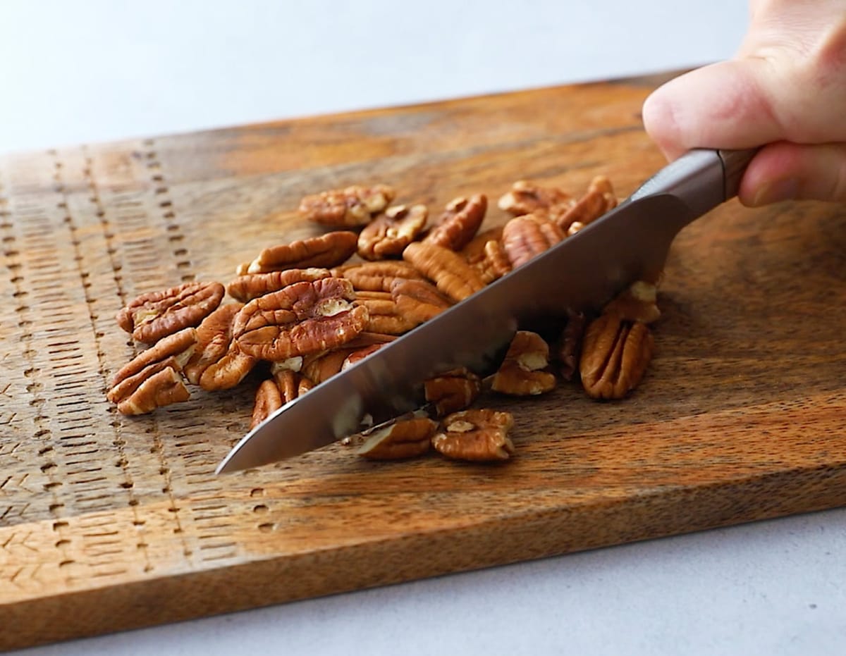 Chopping pecans for gluten-free carrot cake