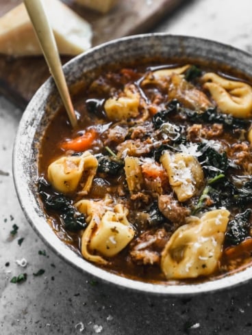 bowl of sausage tortellini soup with kale
