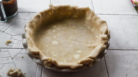 Crust dough in pie dish