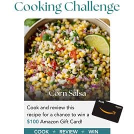 Bowl of colorful corn salsa with lime wedge; text promotes a July cooking challenge to win a $100 Amazon gift card.