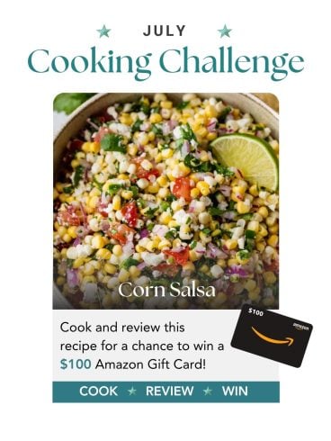 Bowl of colorful corn salsa with lime wedge; text promotes a July cooking challenge to win a $100 Amazon gift card.