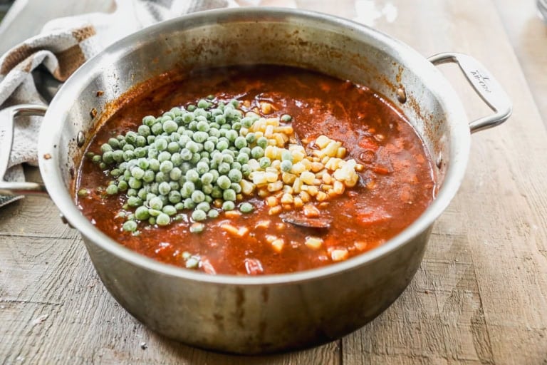 Peas and corn added to cowboy stew