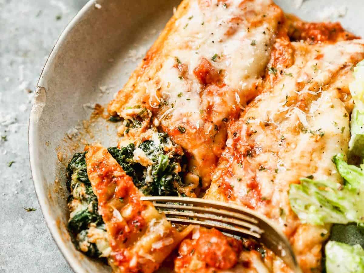 Spinach manicotti on plate