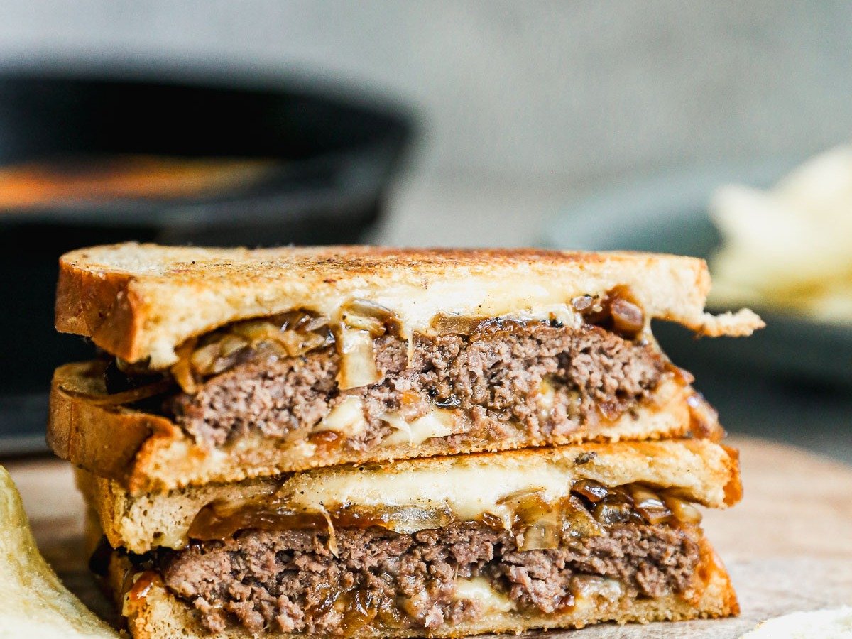 Patty melt sandwich on cutting board