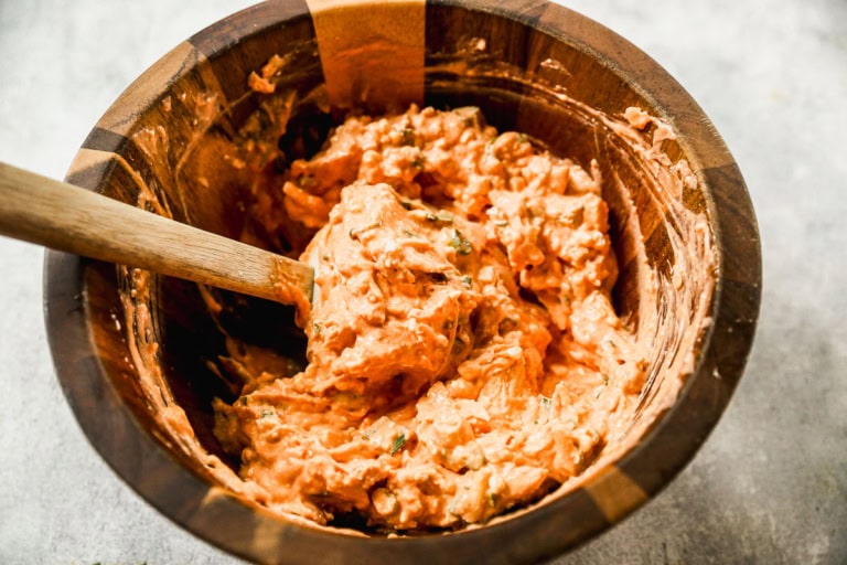 Stirring together ingredients for healthy Buffalo chicken dip
