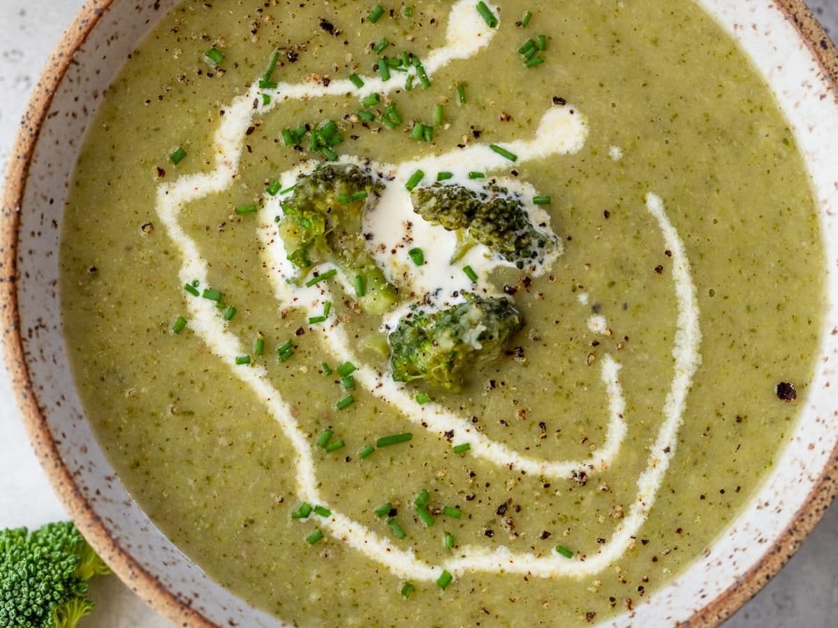Overhead view of cream of broccoli soup in bowl