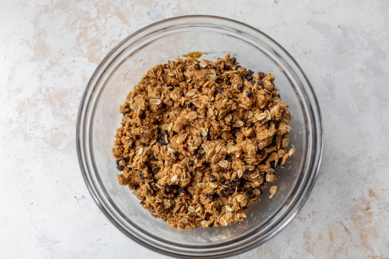 Peanut butter protein bar mixture with chocolate chips in bowl