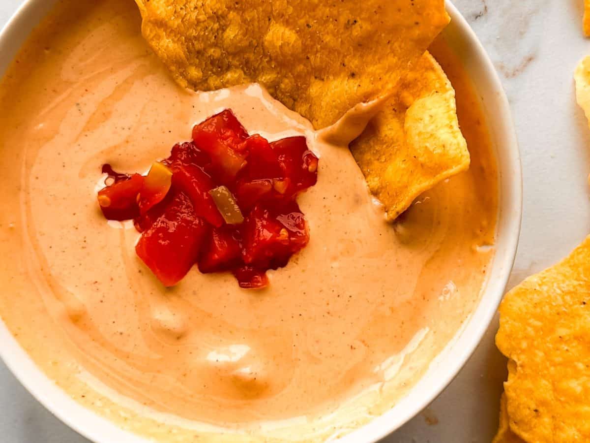 cottage cheese queso in a bowl with tortilla chips