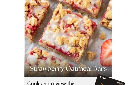 Overhead view of strawberry oatmeal bars with icing, promoting a May cooking challenge to win a $100 Amazon gift card.