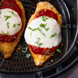 Air fryer chicken Parmesan in air fryer basket.