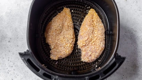 Dredged chicken cutlets in air fryer before cooking.