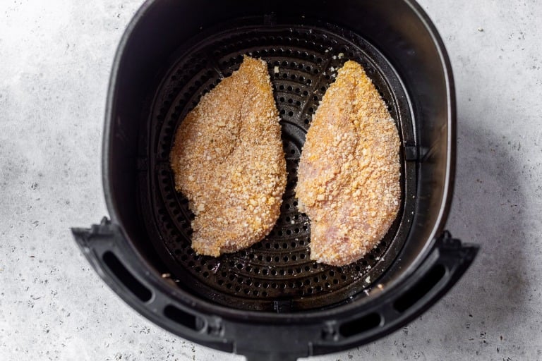 Dredged chicken cutlets in air fryer before cooking.