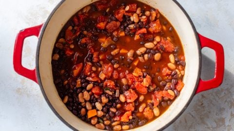 Vegan chili simmering in Dutch oven.