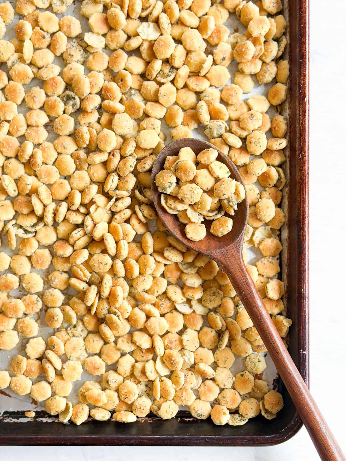 toasted ranch crackers on a sheet pan