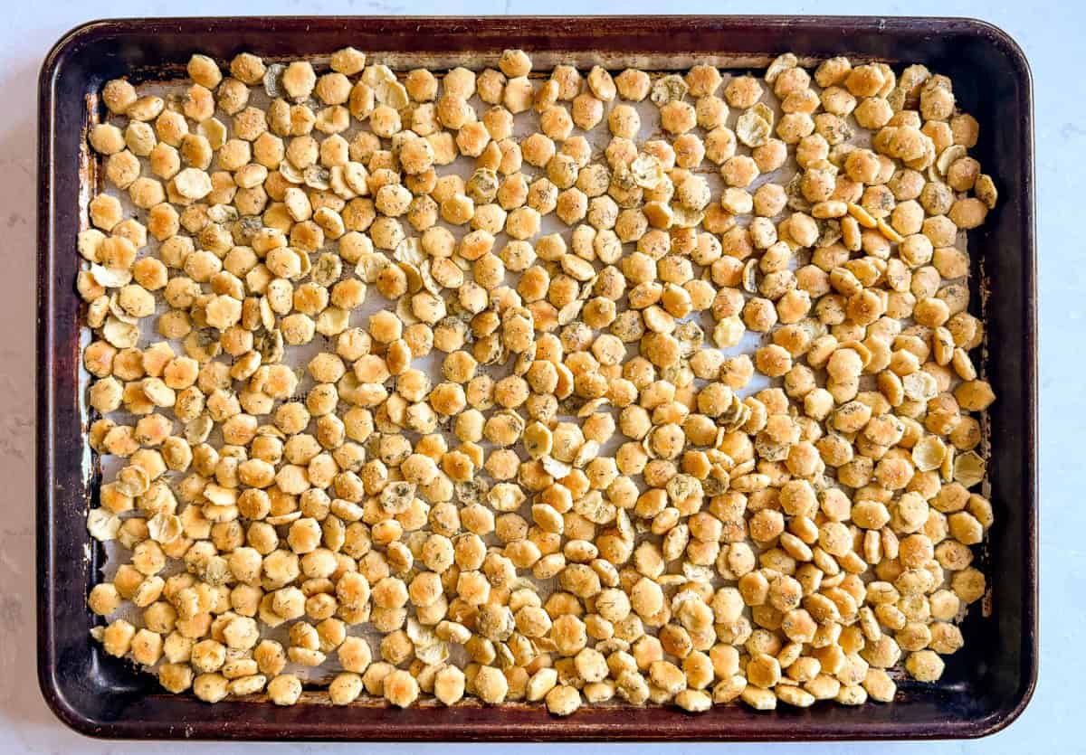 a sheet pan with seasoned crackers