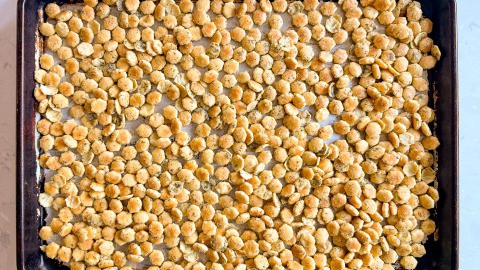 a sheet pan with seasoned crackers