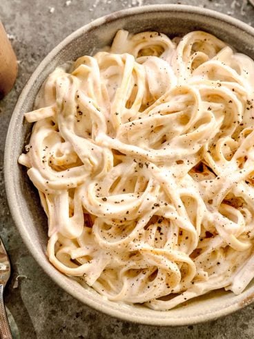 Fettuccine with cottage cheese alfredo sauce in bowl.
