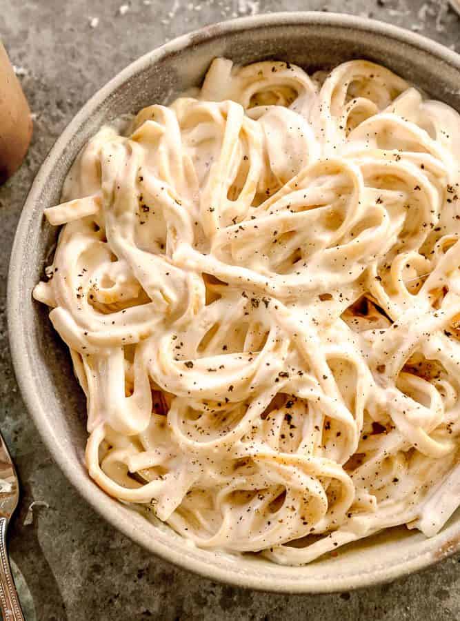 Fettuccine with cottage cheese alfredo sauce in bowl.
