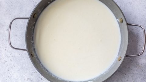 Bechamel sauce in skillet.