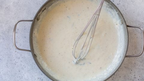 Whisk in pan of bechamel sauce.