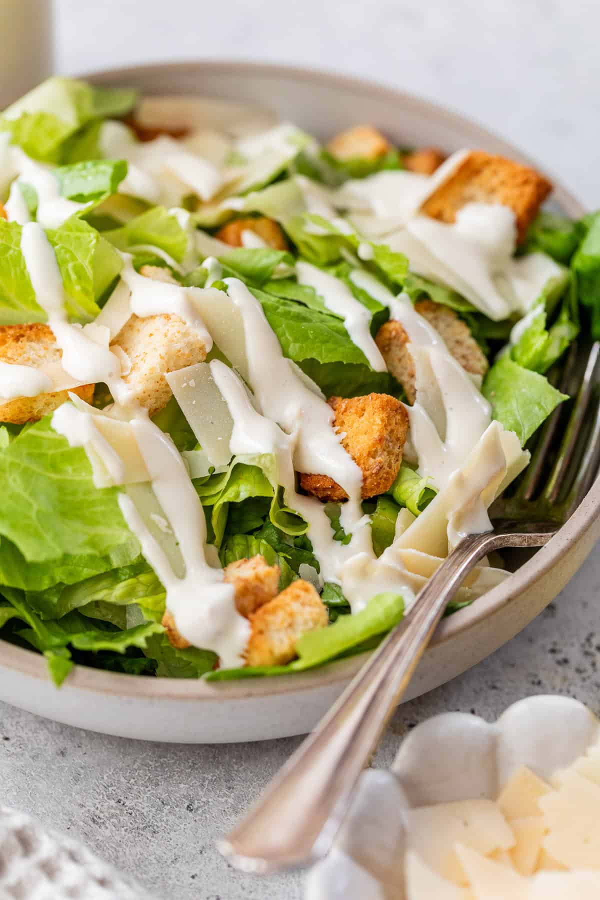 Bowl of Caesar salad with homemade dressing.