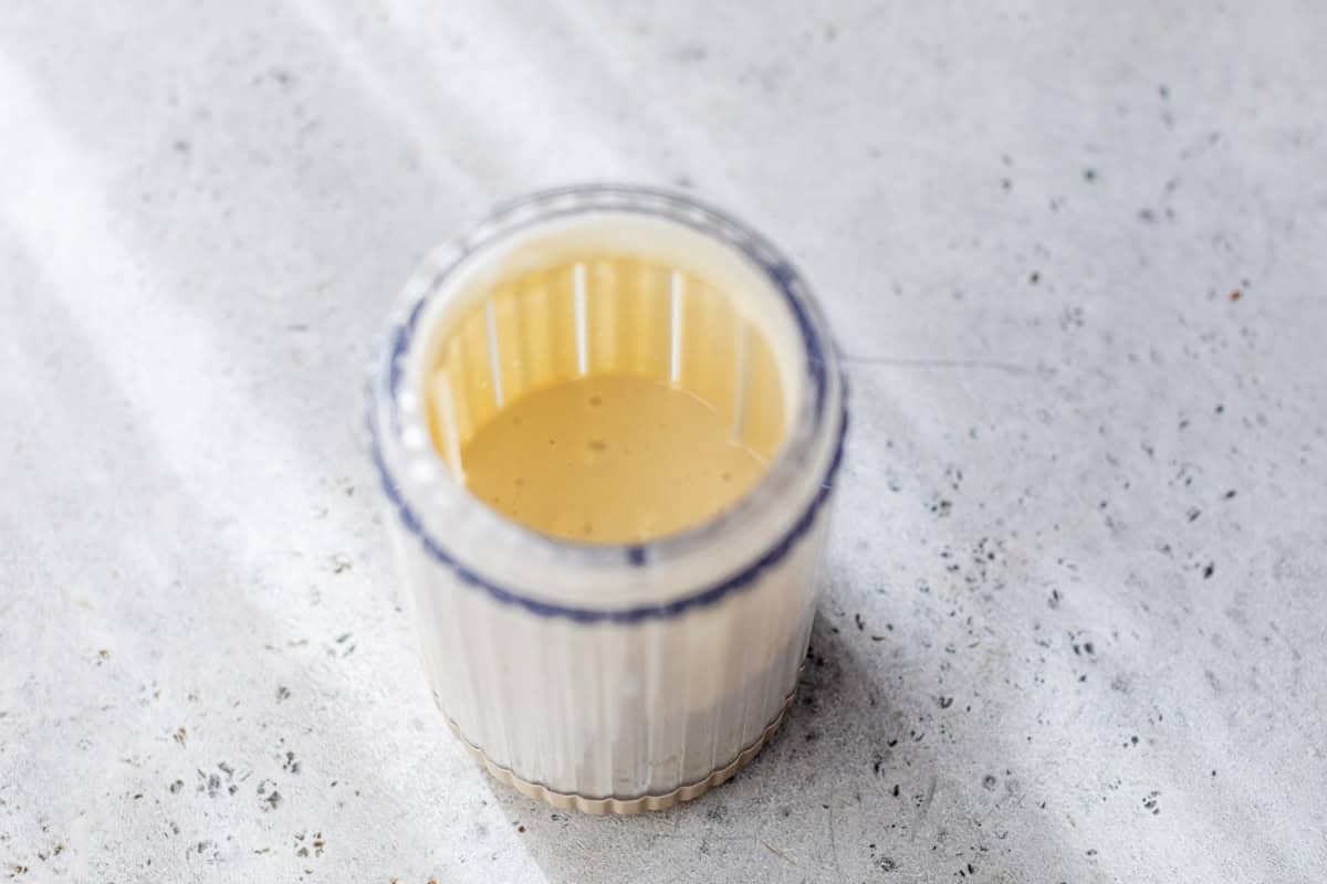 Caesar dressing in jar.