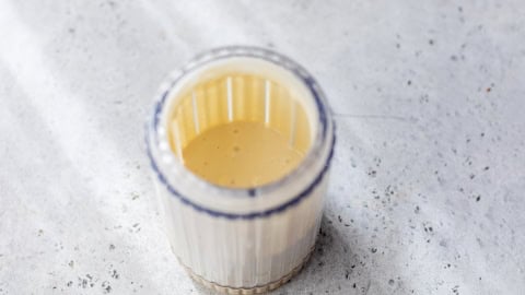 Caesar dressing in jar.