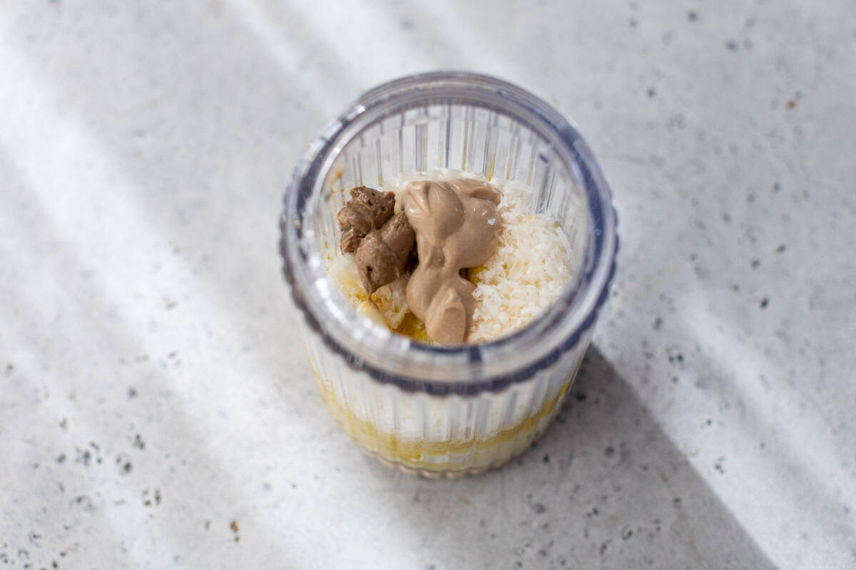 Ingredients for Caesar dressing in jar.