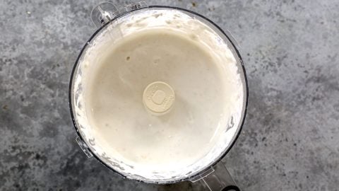 Cottage cheese alfredo sauce in food processor bowl.