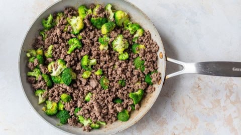 Ground beef and broccoli in skillet.
