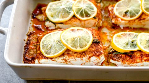 Baked halibut in baking dish.