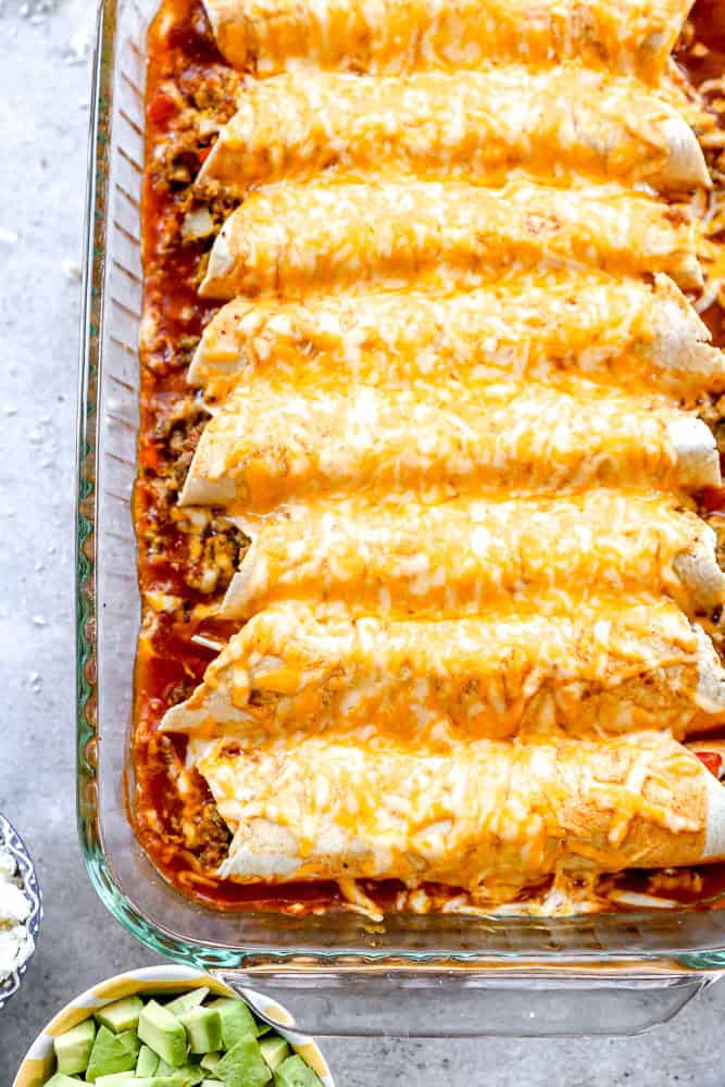 Cheesy breakfast enchiladas in casserole dish.