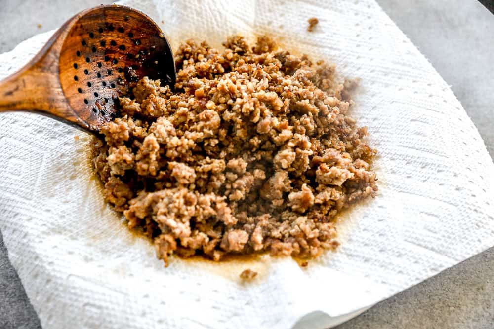Crumbled breakfast sausage draining on paper towel.