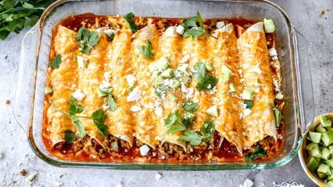 Breakfast enchiladas baked in casserole dish.