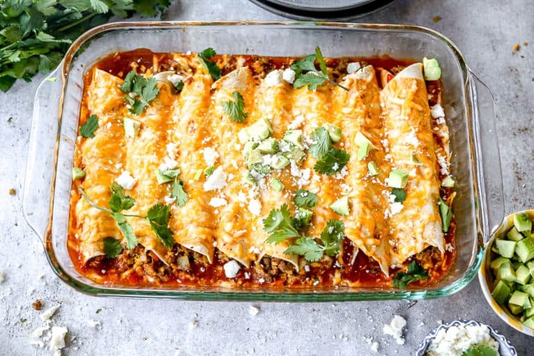 Breakfast enchiladas baked in casserole dish.