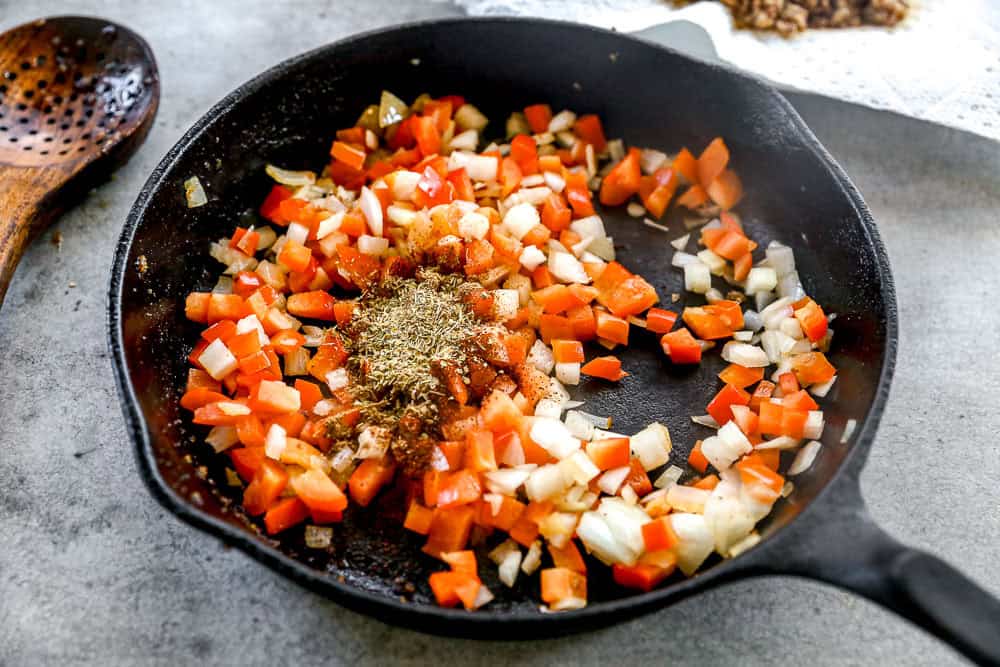 Sauteed peppers, onion, and seasonings in skillet.