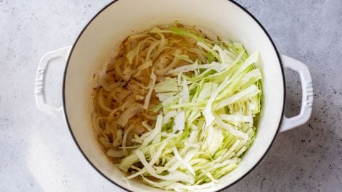 A pot of shredded cabbage and onions.