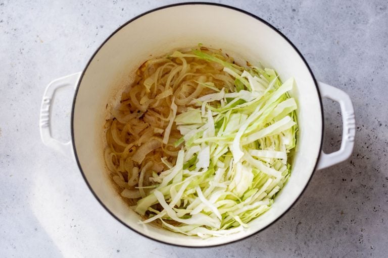 A pot of shredded cabbage and onions.