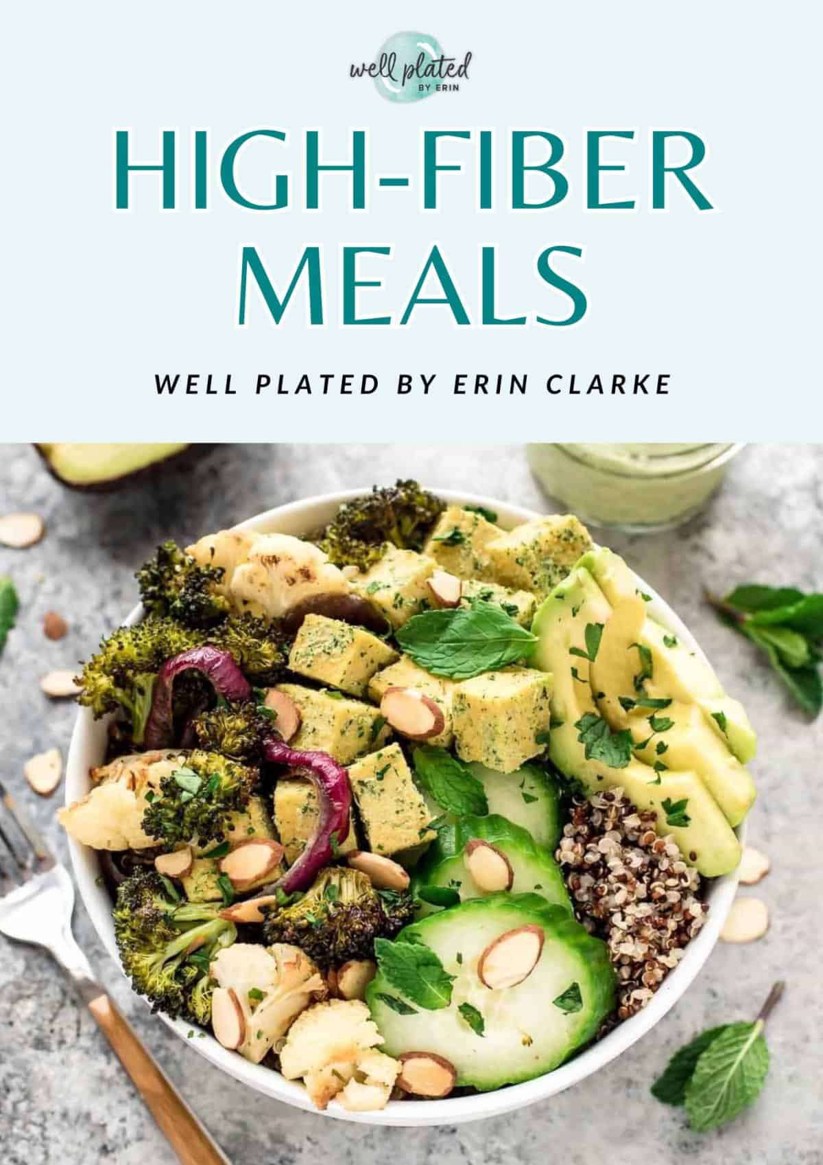 A bowl of high-fiber food with quinoa, tofu, broccoli, avocado, almonds, and herbs on a white table.