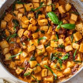 Marry me tofu in a creamy tomato sauce with sun-dried tomatoes and basil.
